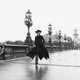 Model Chantal Dumont crosses the Alexandre III bridge in Paris.